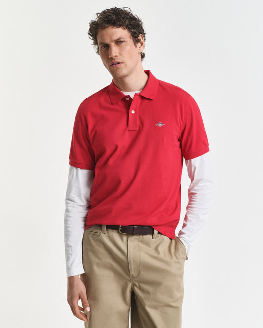 Polohemd aus Piqué mit regular fit und Wappen-Logo